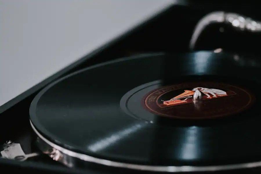 A close-up look at a vintage vinyl record spinning on a classic turntable.