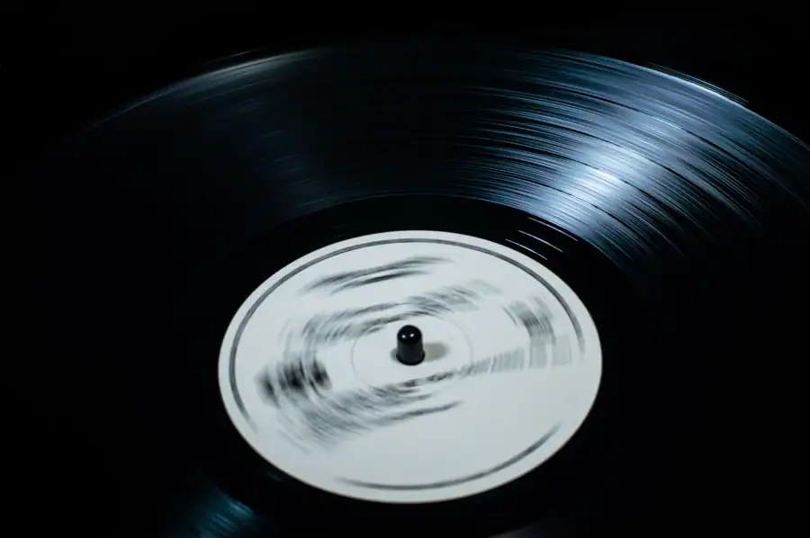 Close-up of a spinning vinyl record in motion, evoking classic music vibes.