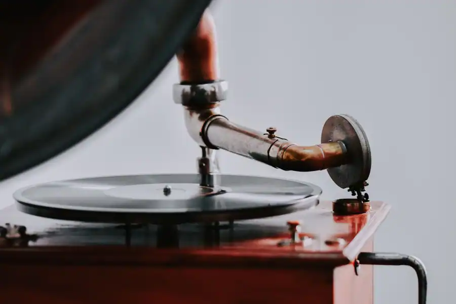 Old-fashioned gramophone playing a vinyl record, showcasing vintage charm and nostalgia.